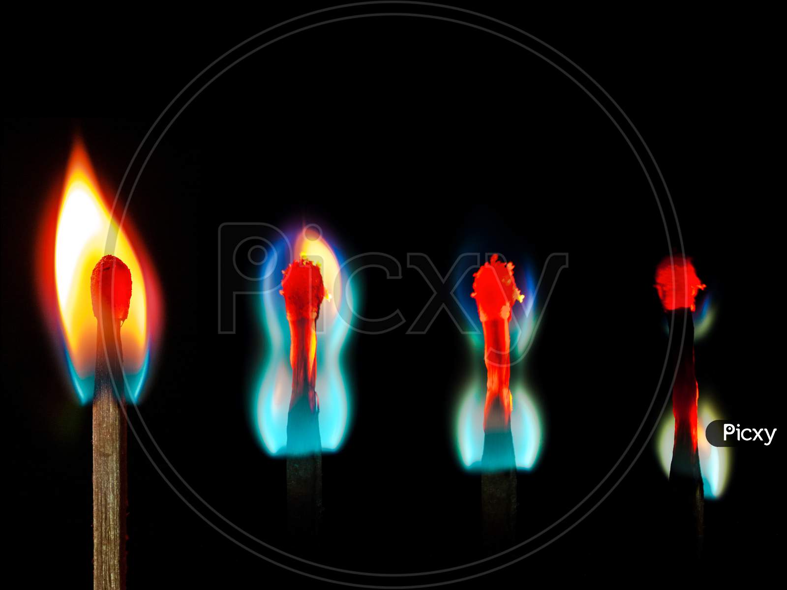 burning candlesticks on black abstract conceptual photo