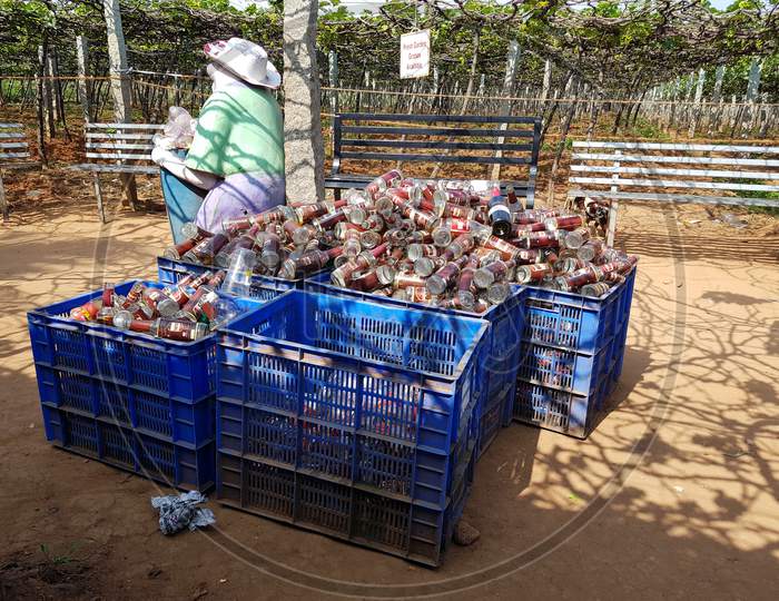 Empty liquor and beer bottles piled up in the dustbin after the wine shops were reopened after Covid19 corona virus pandemic lockdown
