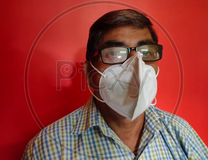 A Old Man Wearing Face Mask For Corona Virus Protection