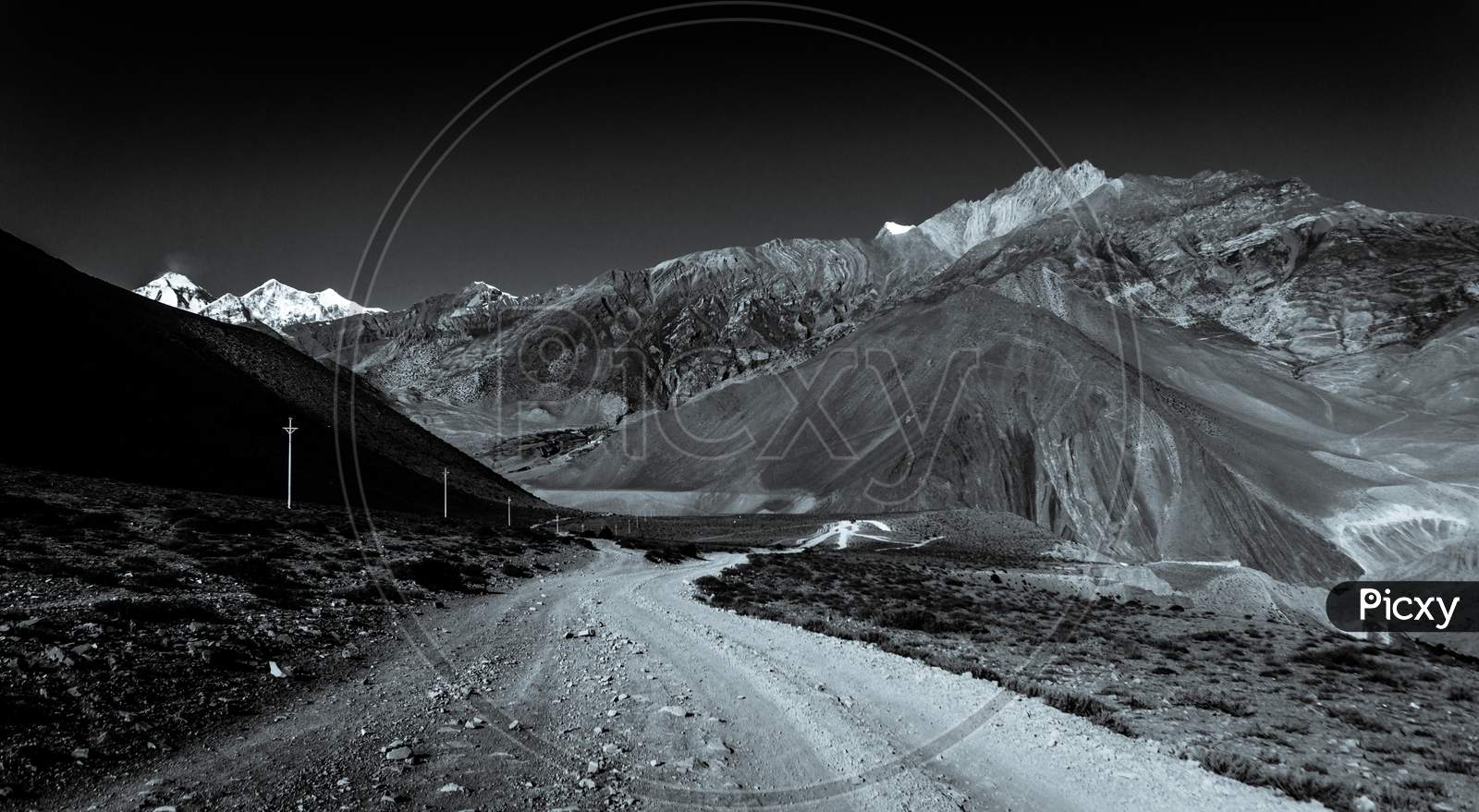 Monochromatic image of road and mountains