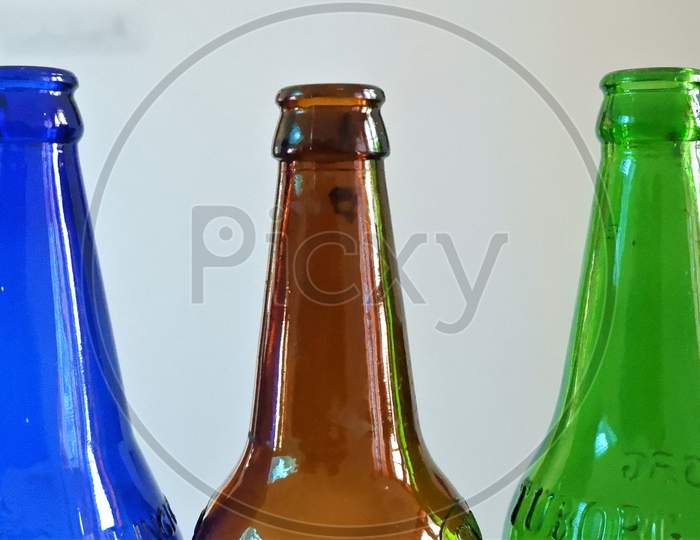 DIFFERENT COLOR BEAUTIFUL BEER BOTTLES in white background