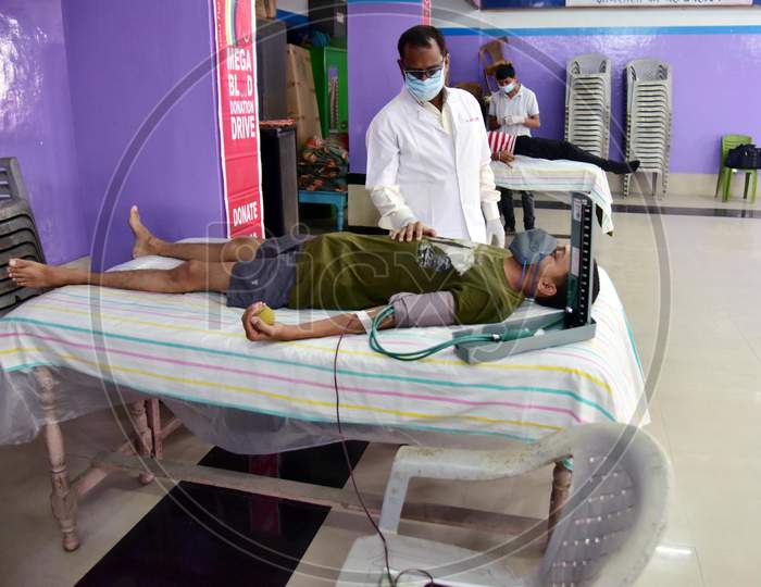 A man Donates Blood Inside a Blood Donation Camp For The Needy Patients During Nationwide Lockdown Amidst Coronavirus Or COVID-19 Pandemic  In Nagaon On May 11, 2020