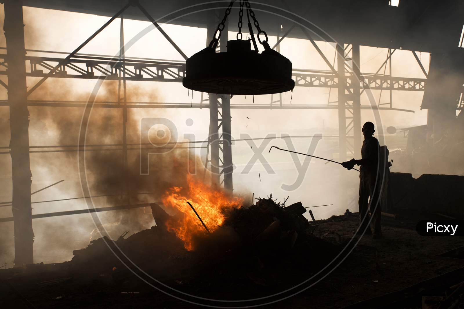 Workers Melt Metal Scraps In The Furnace Of A Steel Mill To Produce Rods In Demra, Dhaka, Bangladesh.