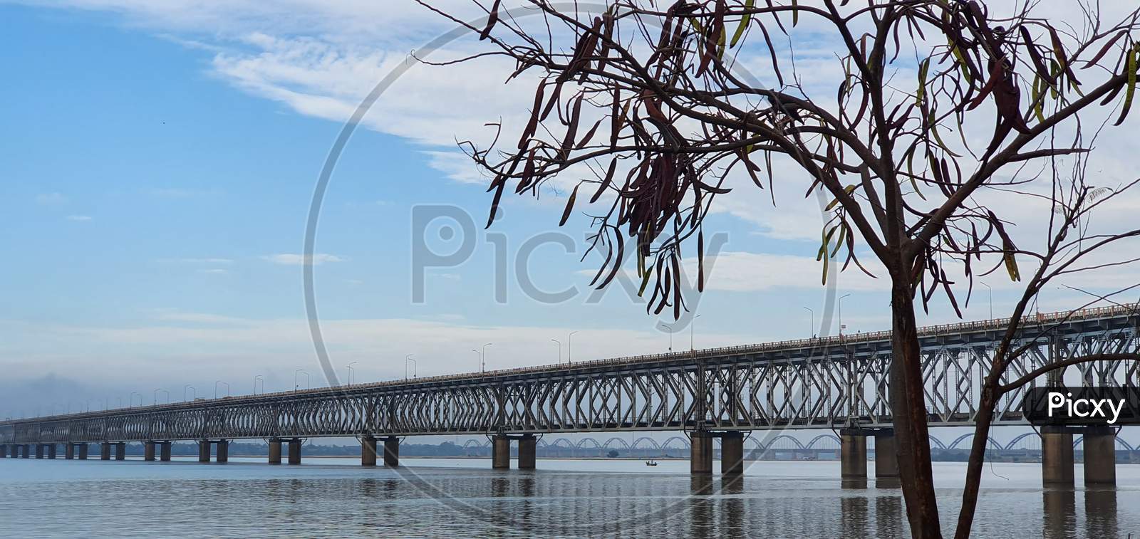 Beautiful image of Asia's longest rail cum raod bridge across the calm Godavari  river in Rajahmundry