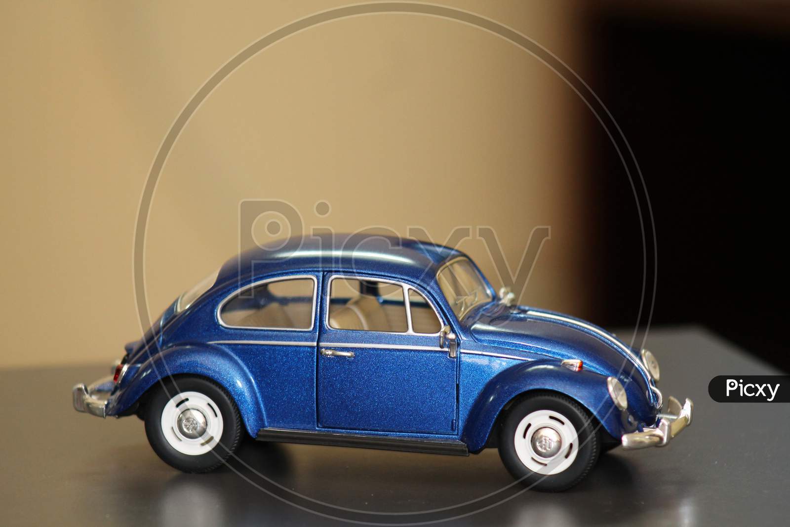 A Miniature Car Isolated On A Blurred Background