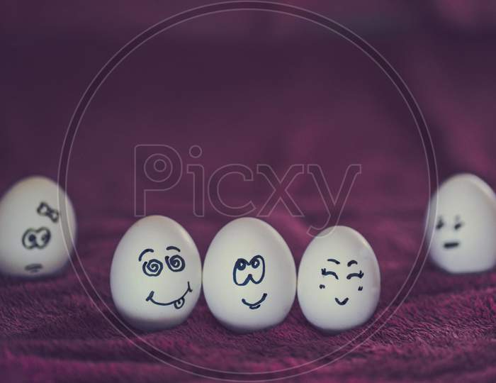 cartoon faces on eggs