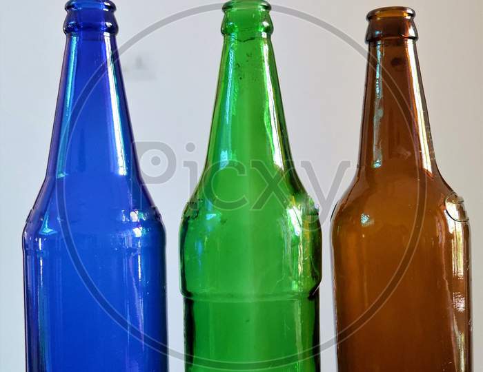 DIFFERENT COLOR BEAUTIFUL BEER BOTTLES in white background