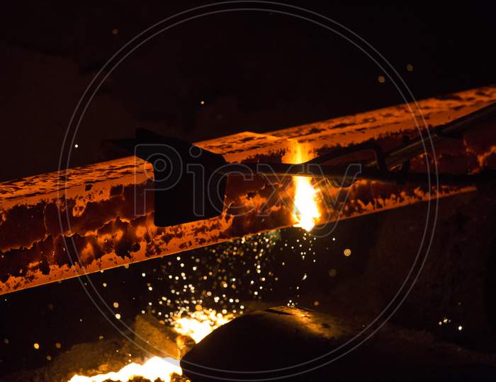 Gas Cutting Of The Hot Metal In Steel Plant At Demra, Dhaka, Bangladesh