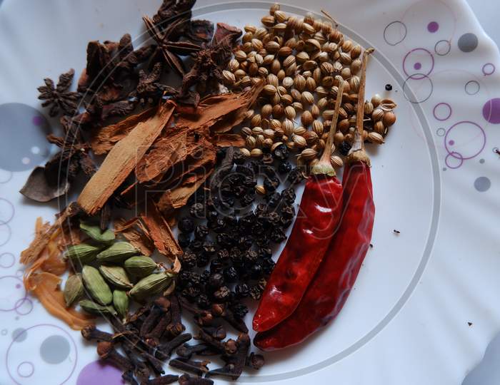 Spices of Kerala. Cinnamon, pepper, clove, star anise, cardamom, nutmeg and curry leaves ,main ingredients of Kerala cuisine.
