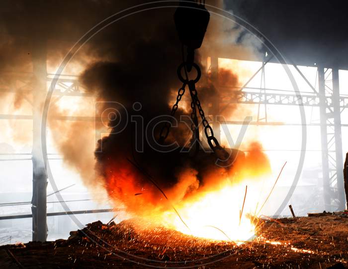 Scrap Steel Melts Down In An Induction Furnace At Demra, Dhaka, Bangladesh.