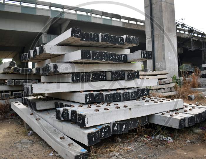 Pile of prefabricated concrete slab used in train track in India.