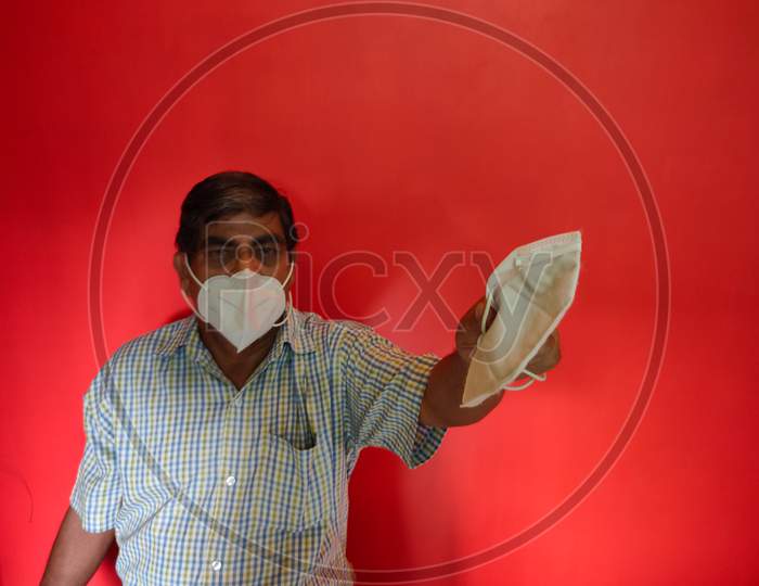 A Old Man Wearing Face Mask & Suggest To Wear Mask For Corona Virus Protection