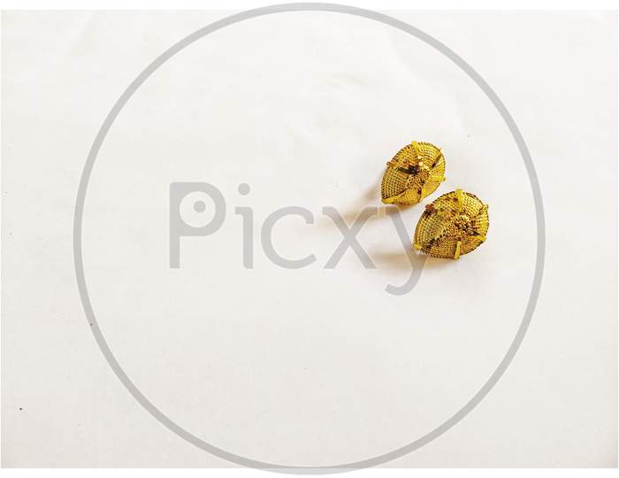 Indian earrings on white background.