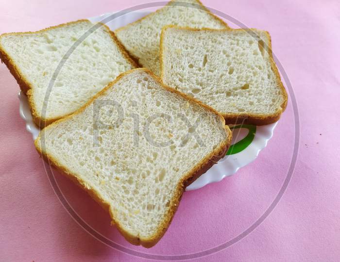 Breakfast bread on colour background