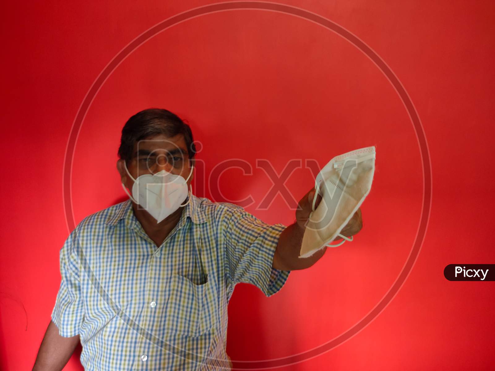 A Old Man Wearing Face Mask & Suggest To Wear Mask For Corona Virus Protection