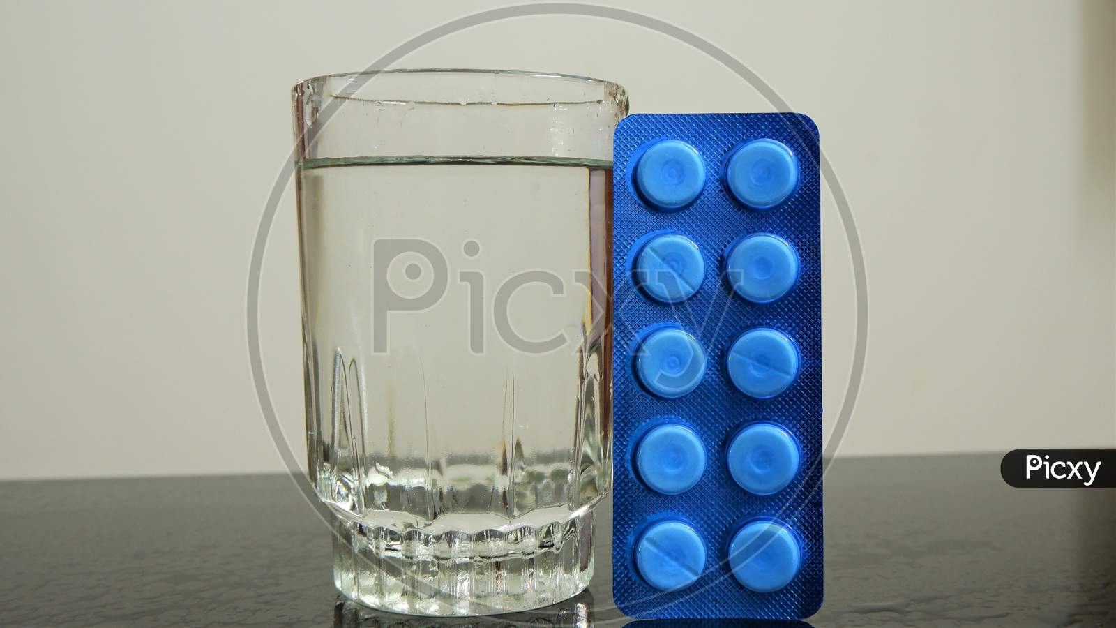 tablet with glass of water