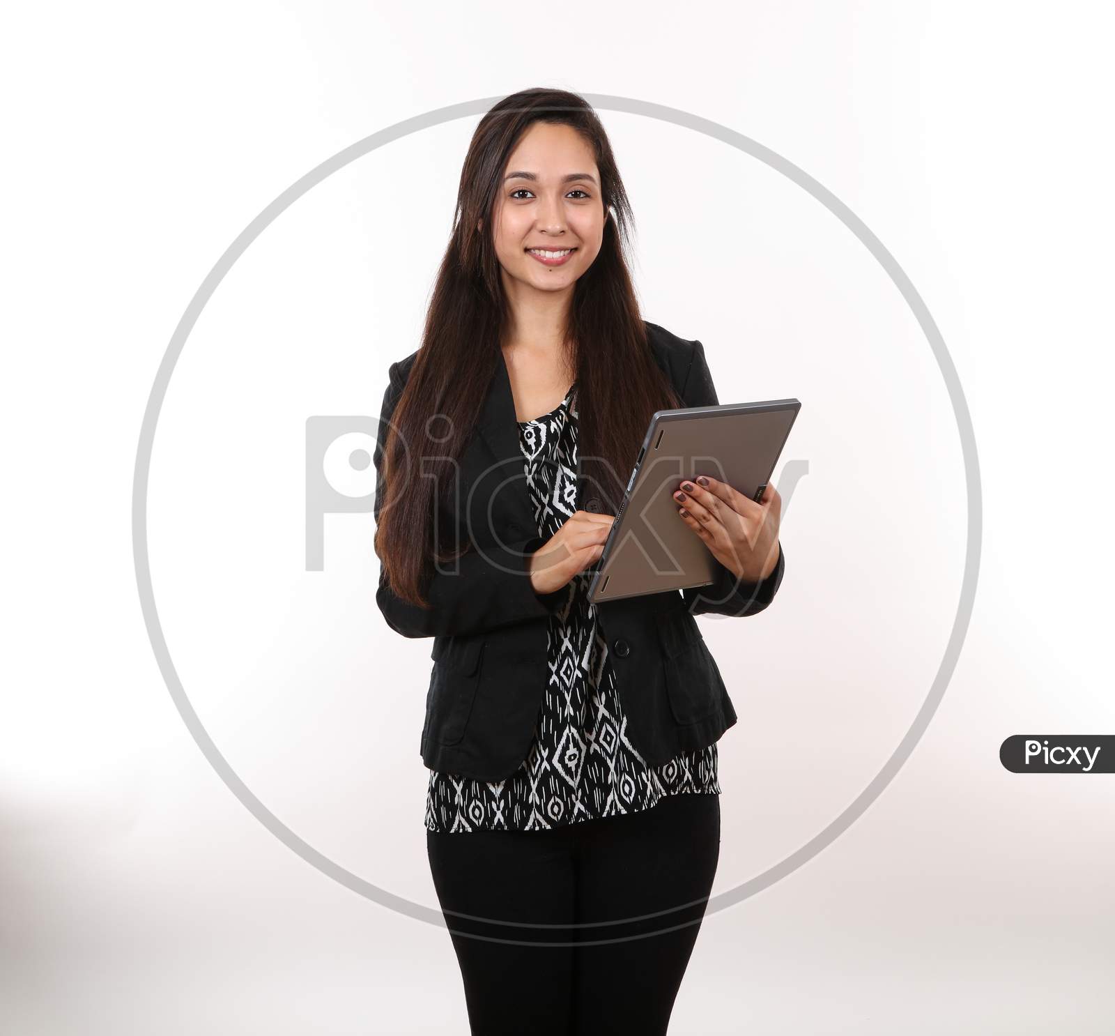 A Young Female Business Woman Holding A Tablet.