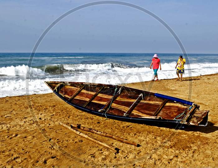 lonely boat and tourist at puri sea beach odisha