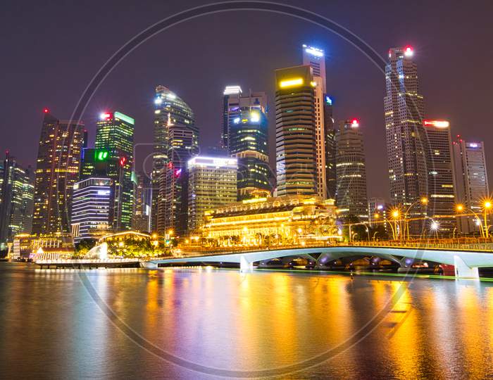 SINGAPORE/SINGAPORE - 01st July, 2019 : Singapore cityscape at dusk. Landscape of Singapore business building around Marina bay.
