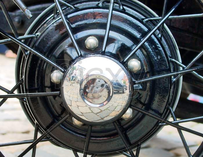 Close up of a wheel rim of an old timer cam