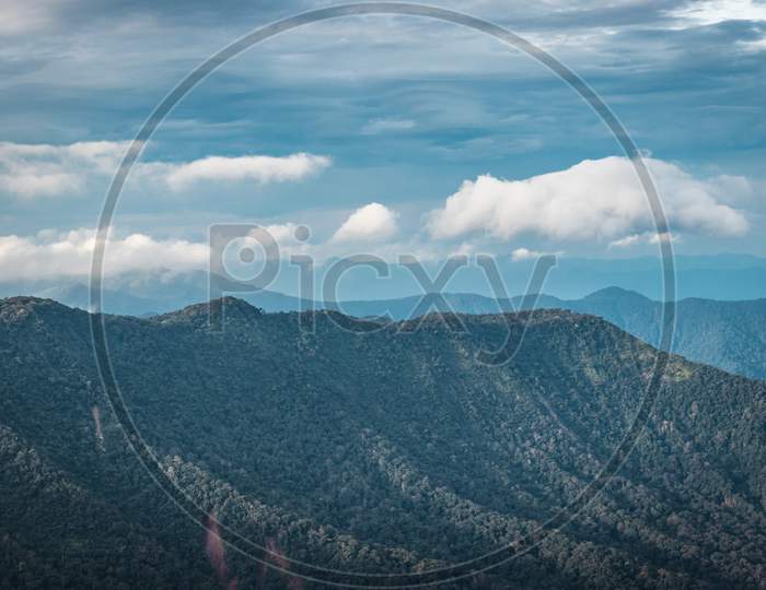 mountain range with white cloud and sky background
