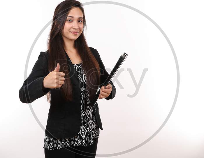 A Young Female Professional Gives The Thumbs Up.
