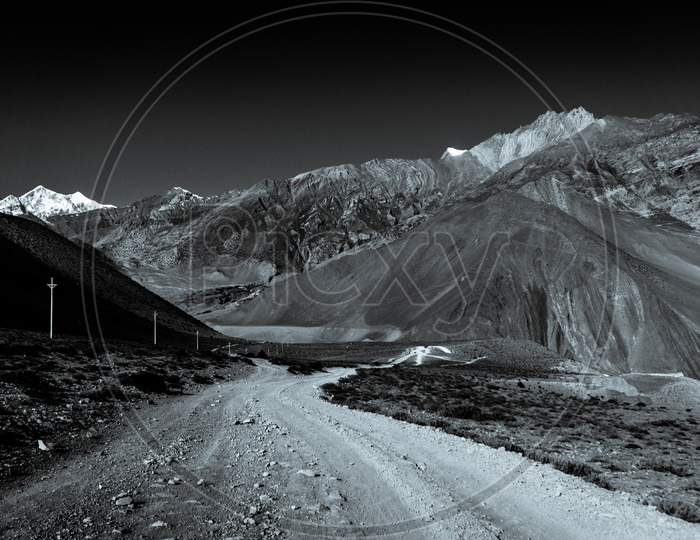 Monochromatic image of road and mountains