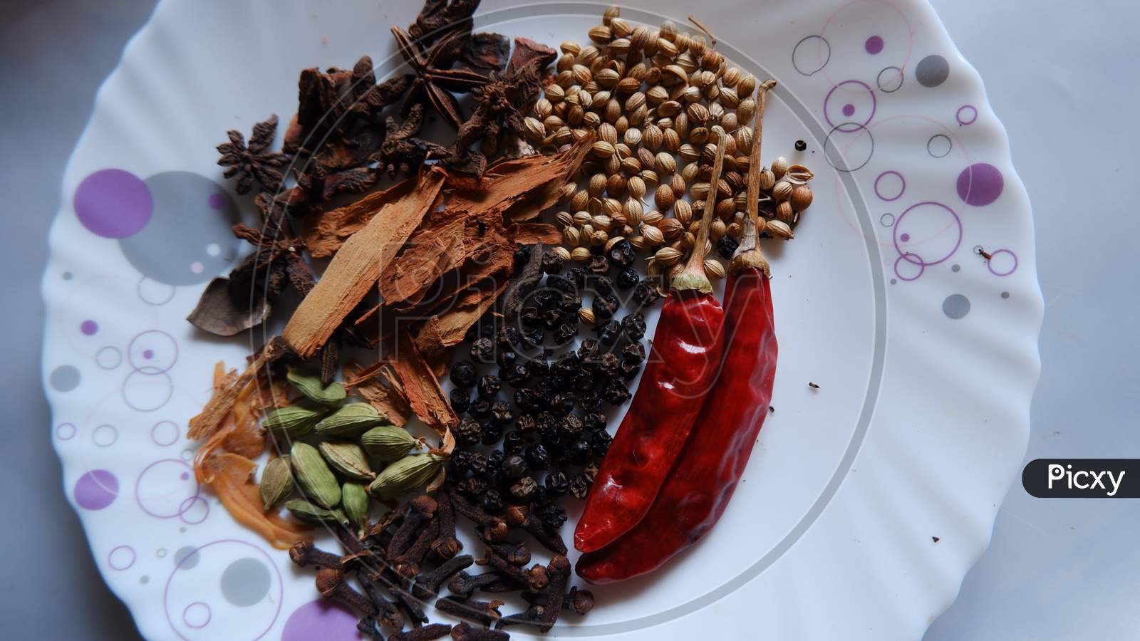 Spices of Kerala. Cinnamon, pepper, clove, star anise, cardamom, nutmeg and curry leaves ,main ingredients of Kerala cuisine.