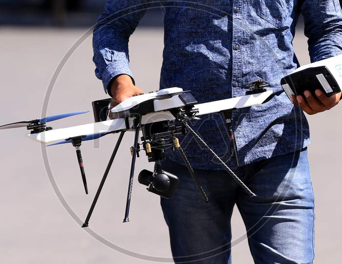 A man holds a drone operated by a security personnel for surveilling a hotspot area during a government-imposed nationwide lockdown as a preventive measure against the COVID-19 or coronavirus, in Ajmer, Rajasthan, India on 06 May 2020.