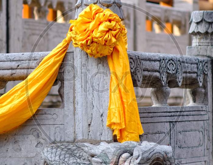Temple Of Confucius, Unesco World Heritage Site In Qufu, Birthplace Of Confucius. Yellow Silk Scarves Decorating The Marble Pillars, Chinese Culture And Architectural Details