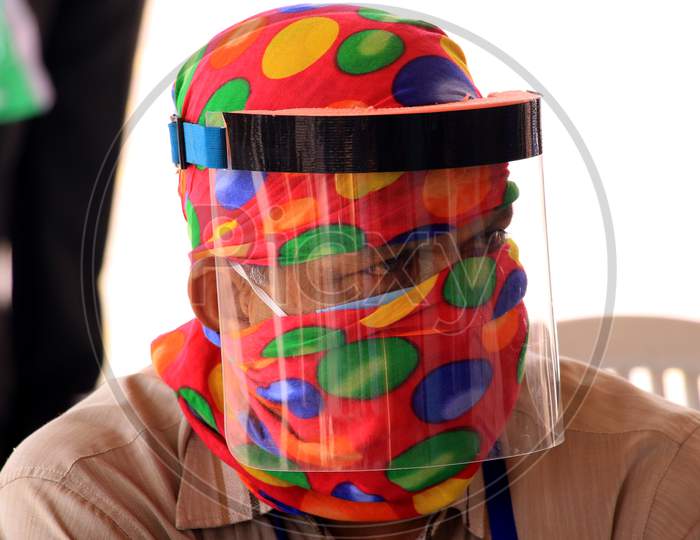 A security personnel wears a glass facemask during a government-imposed nationwide lockdown as a preventive measure against the COVID-19 or Coronavirus, in Ajmer on May 10, 2020.