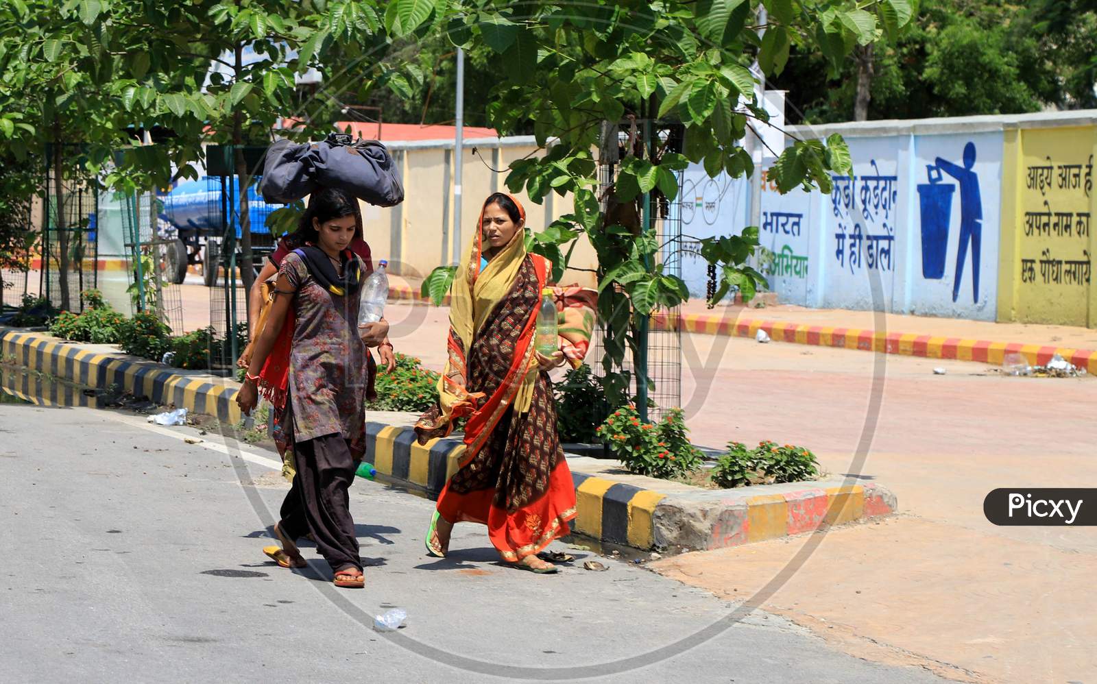 Migrant Workers Walk On The Road To Reach Their Native Places During Nationwide Lockdown Amidst Coronavirus Or Covid-19 Pandemic In Prayagraj, May 12, 2020