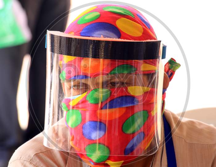 A security personnel wears a glass facemask during a government-imposed nationwide lockdown as a preventive measure against the COVID-19 or Coronavirus, in Ajmer on May 10, 2020.