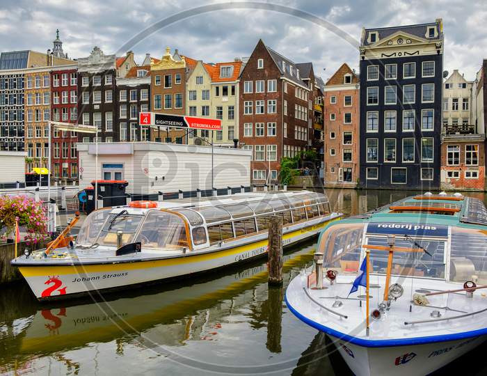 Amsterdam, Capital Of The Netherlands, With Its Iconic Canals And Colorful Old Facades