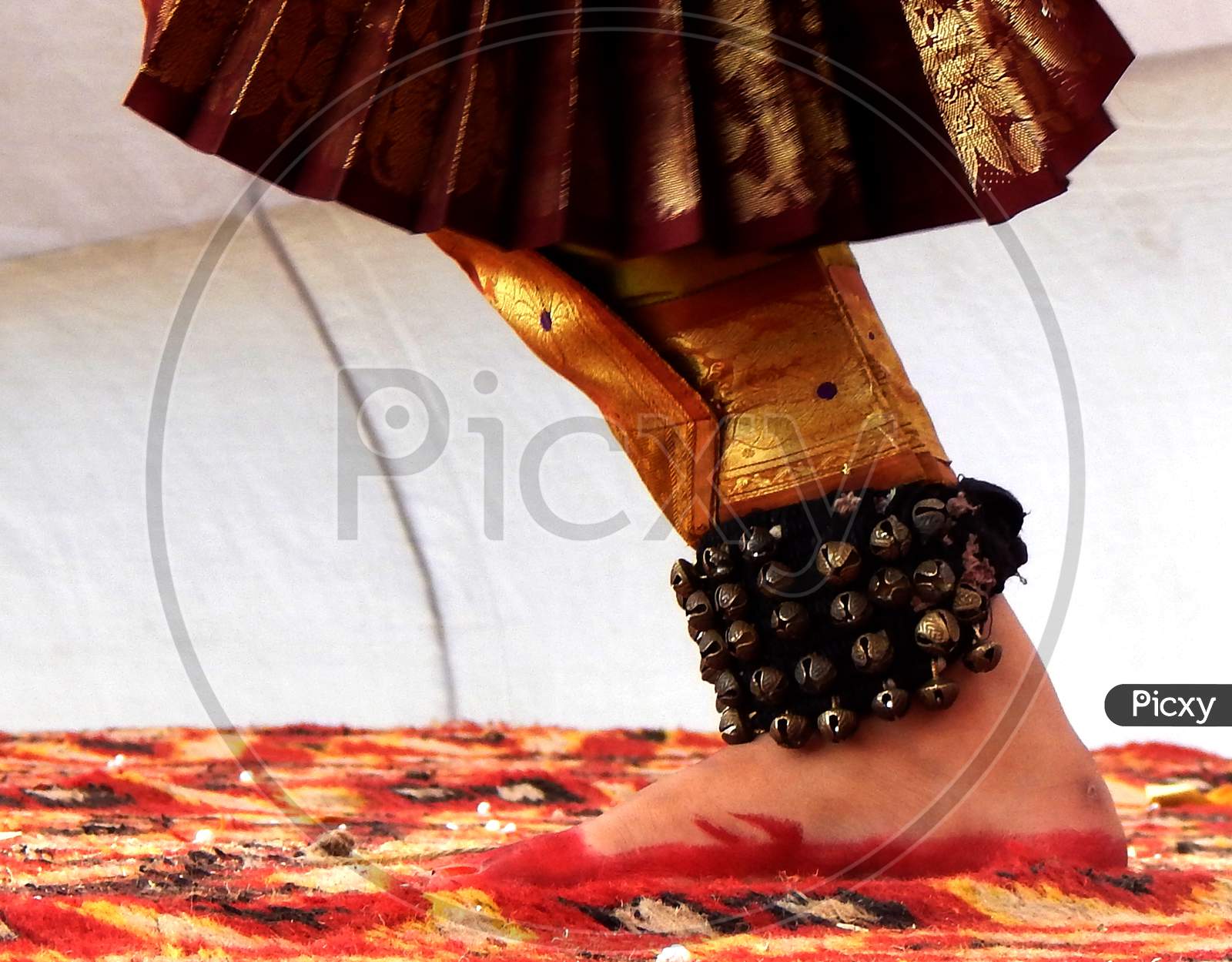 Foot of an Indian Classical Dancer with mehandi and ghungru.