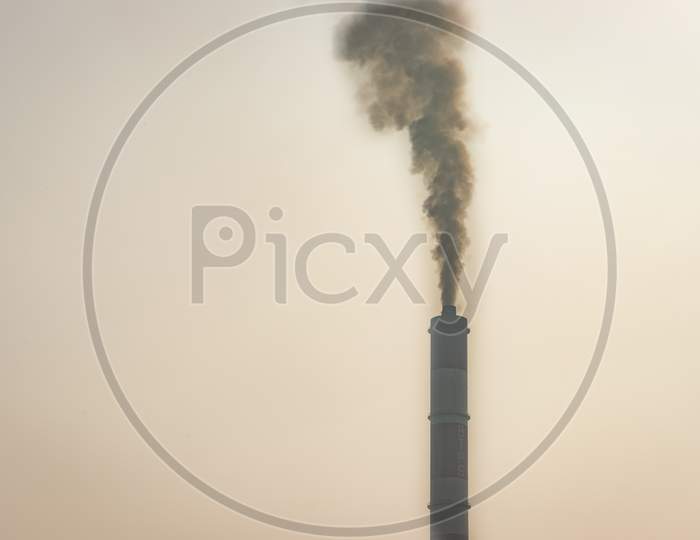 Black Polluted Smoke Coming Out From Industry Showing The Environmental Concern.