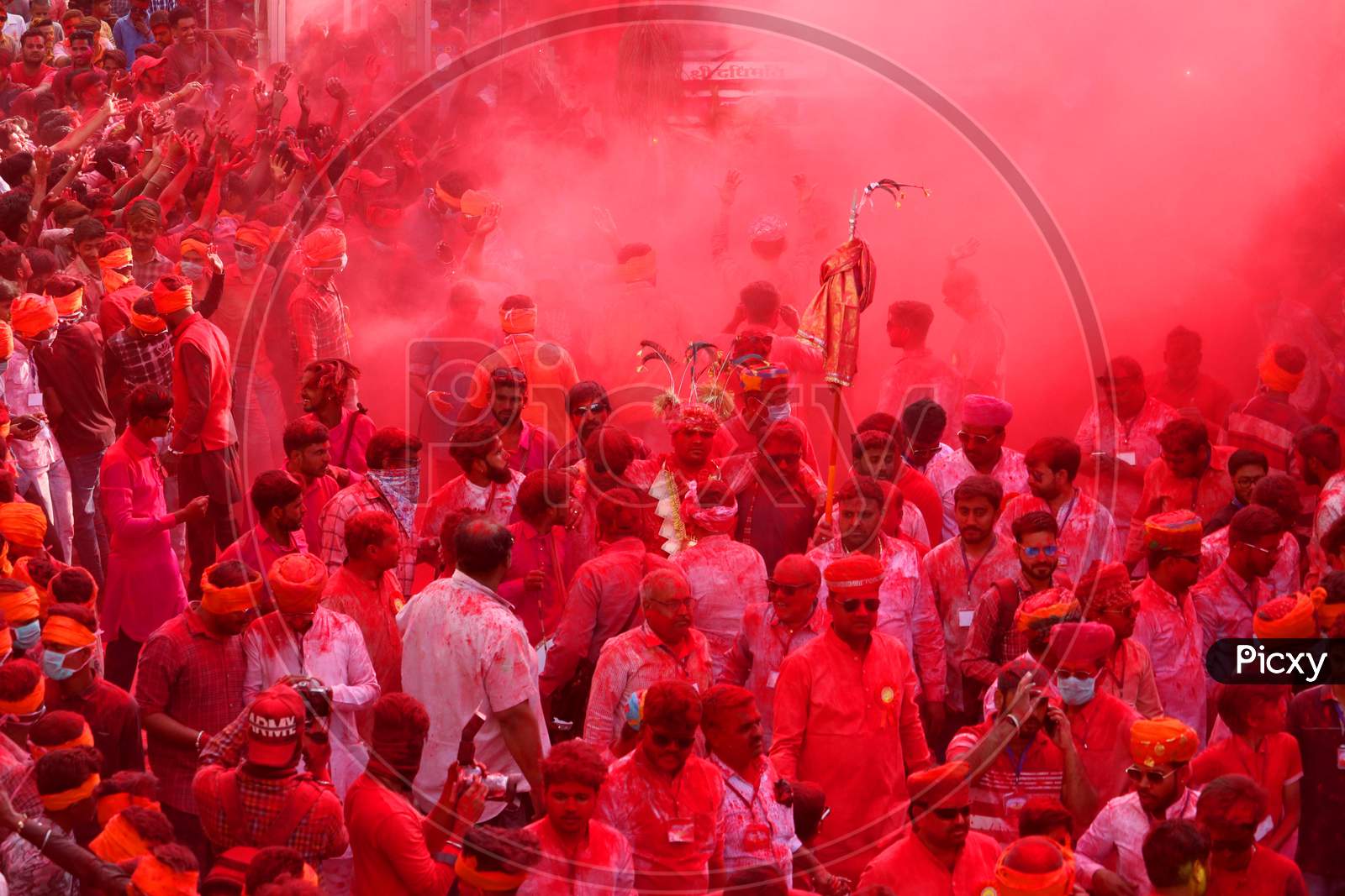 Men daubed in colour dance as they take part in a colourful procession locally known as "Badshah ki Sawari" as part of Holi, the Festival of Colours, celebrations in Beawar, in the desert state of Rajasthan, India, 11 March 2020