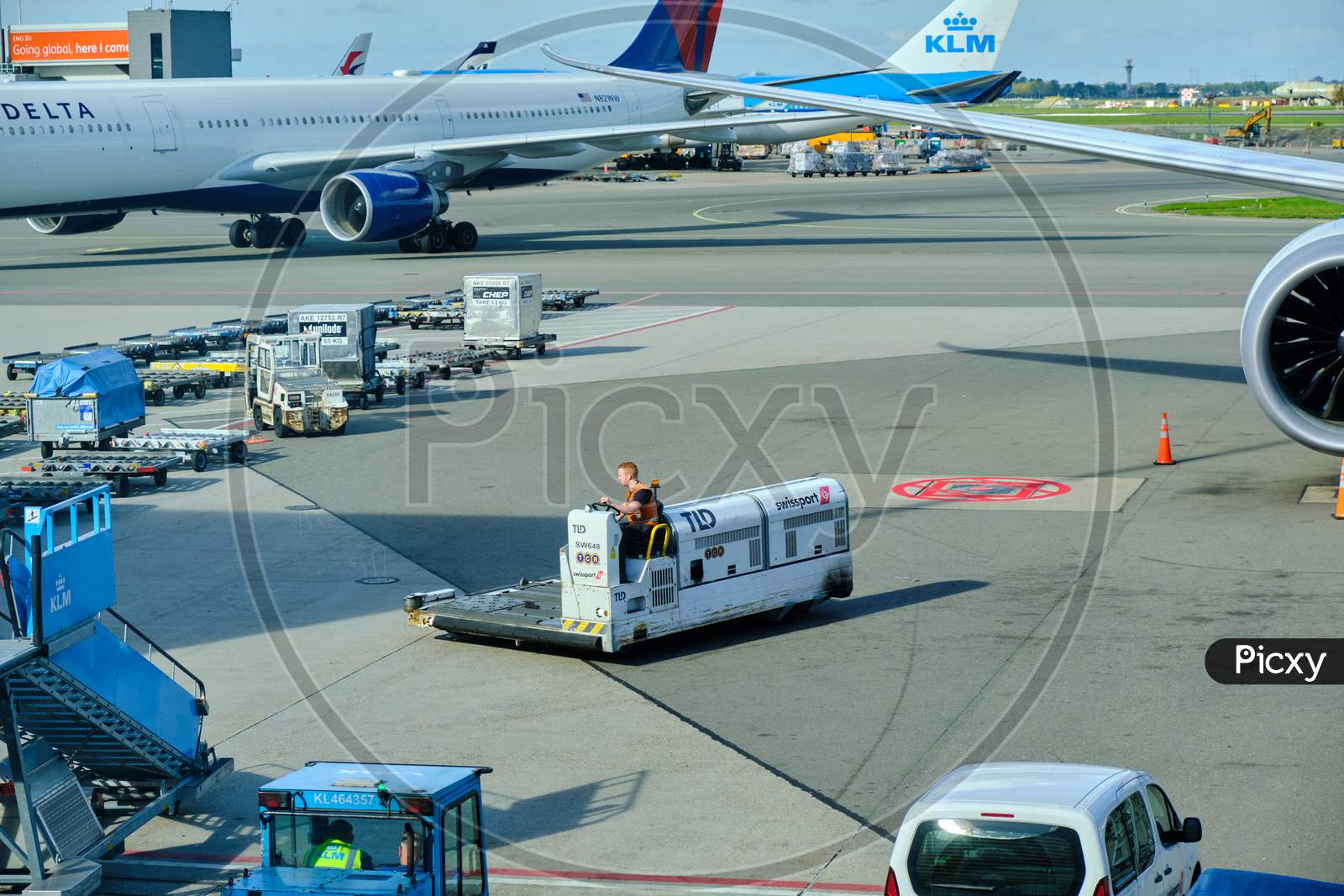 Airport Baggage Tractor At Amsterdam Airport Schiphol In Amsterdam, Netherlands