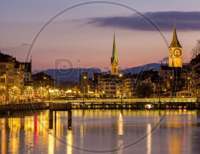 Zurich On Banks Of Limmat River At Winter Evening