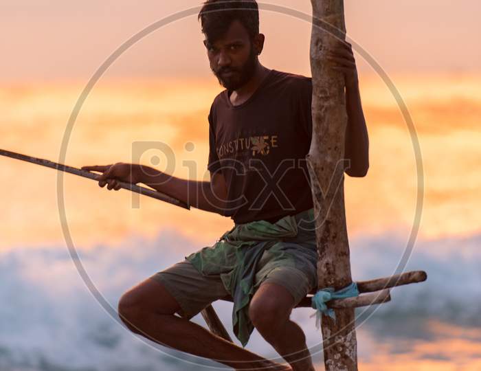 Koggala, Sri Lanka : 2019 Nov 18 : Silhouettes Of The Traditional Sri Lankan Stilt Fishermen On A Stormy In Koggala, Sri Lanka. Stilt Fishing Is A Method Of Fishing Unique To The Island Country Of Sri Lanka