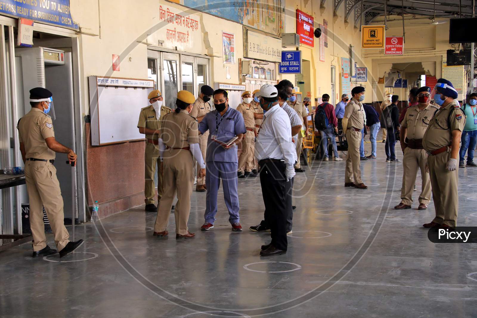  Security personnel stand near a special train which will be on-boarded by migrants to Bihar State from Ajmer railway station during a government-imposed nationwide lockdown as a preventive measure against the COVID-19 or coronavirus, in Ajmer on May 10, 2020.