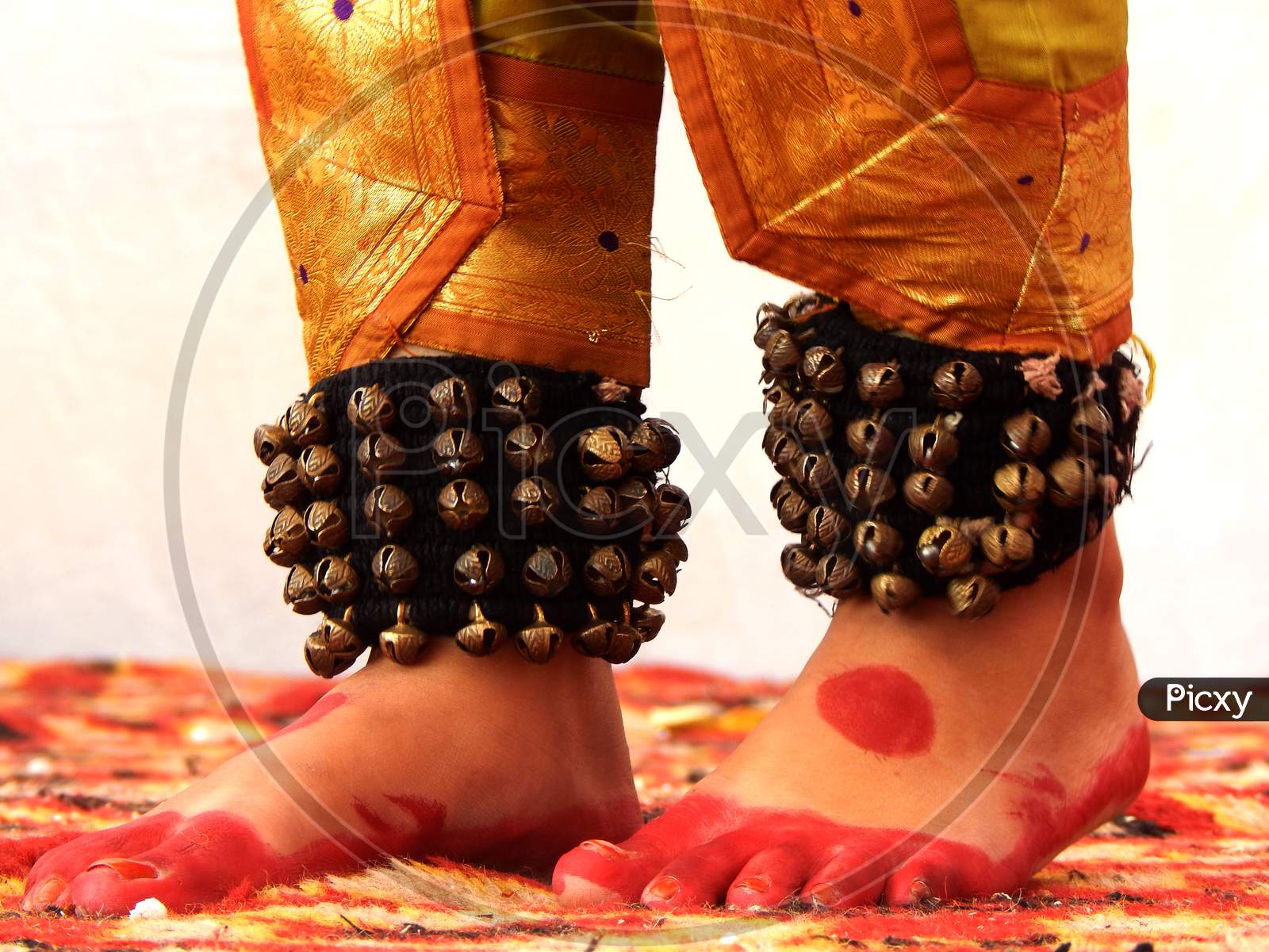 Foot of an Indian Classical Dancer with mehandi and ghungru.