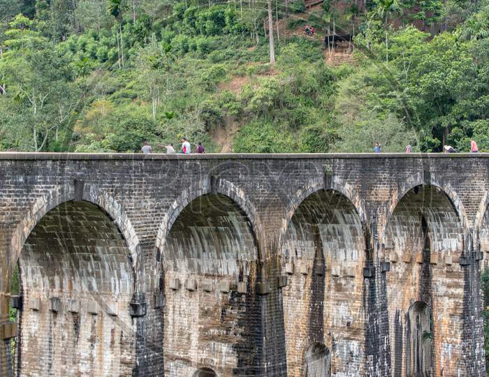 Ella / Sri Lanka - November 18 2020 : The Unspecific People Had Taking Photo With Moving Train. The Train Was Moving Through The Nine Arches Bridge At The Ella, Sri Lanka. Here'S One Of The Famous Place.