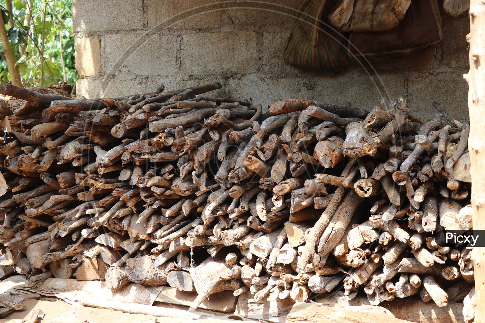 Pile Of Cut Wood Trunks Stocked For Burning In Winter