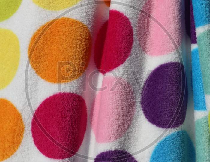 Close up surface of colorful fabrics cloth and textiles being folded and hang up in high resolution