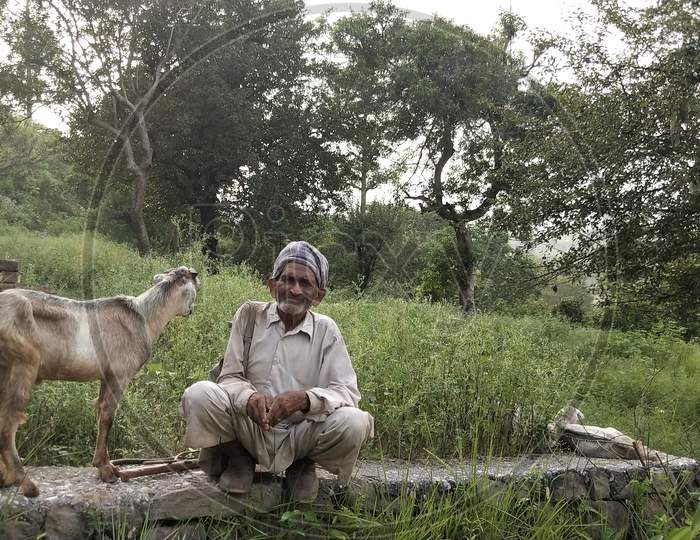 Old man with goat