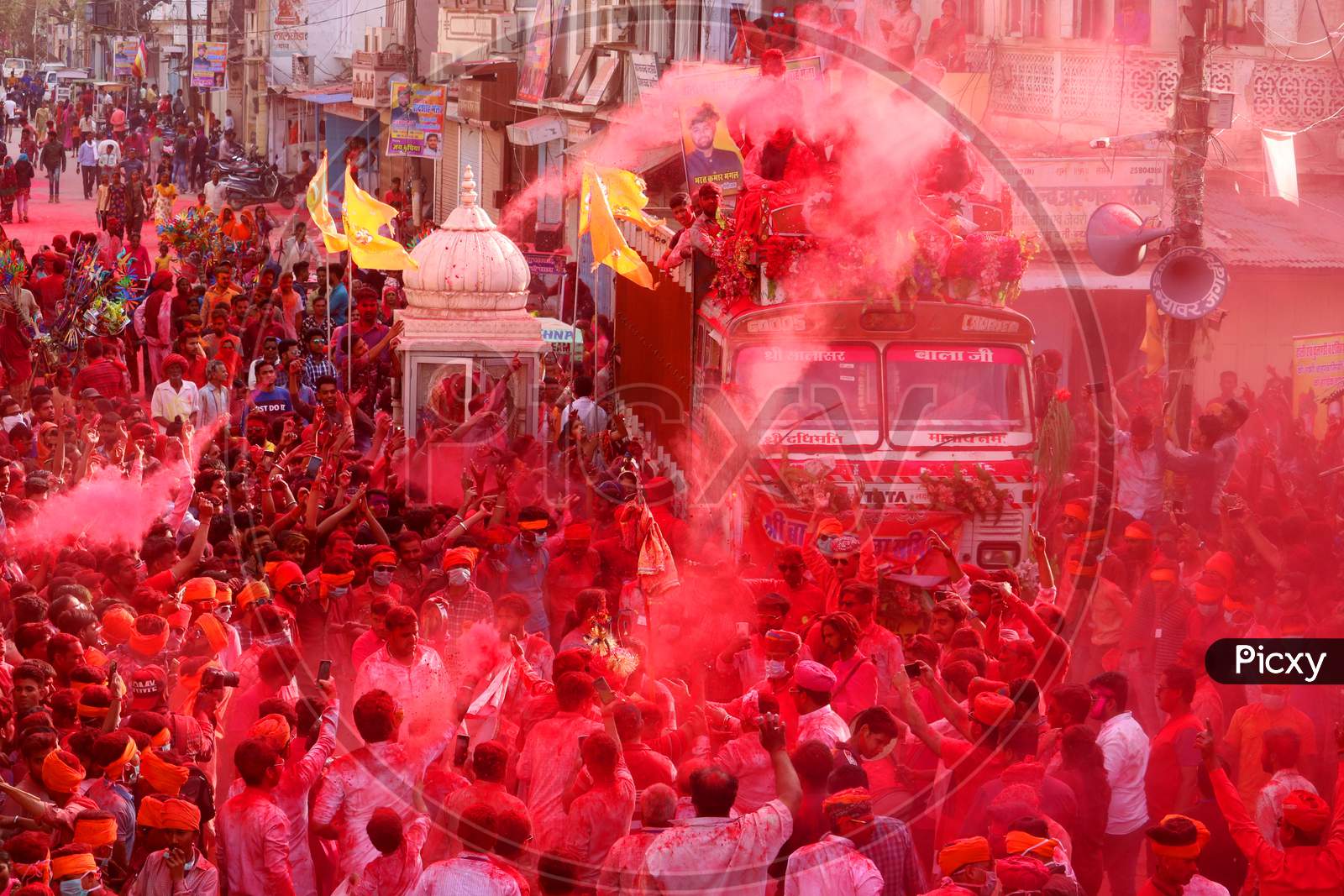 Men daubed in colour dance as they take part in a colourful procession locally known as "Badshah ki Sawari" as part of Holi, the Festival of Colours, celebrations in Beawar, in the desert state of Rajasthan, India, 11 March 2020