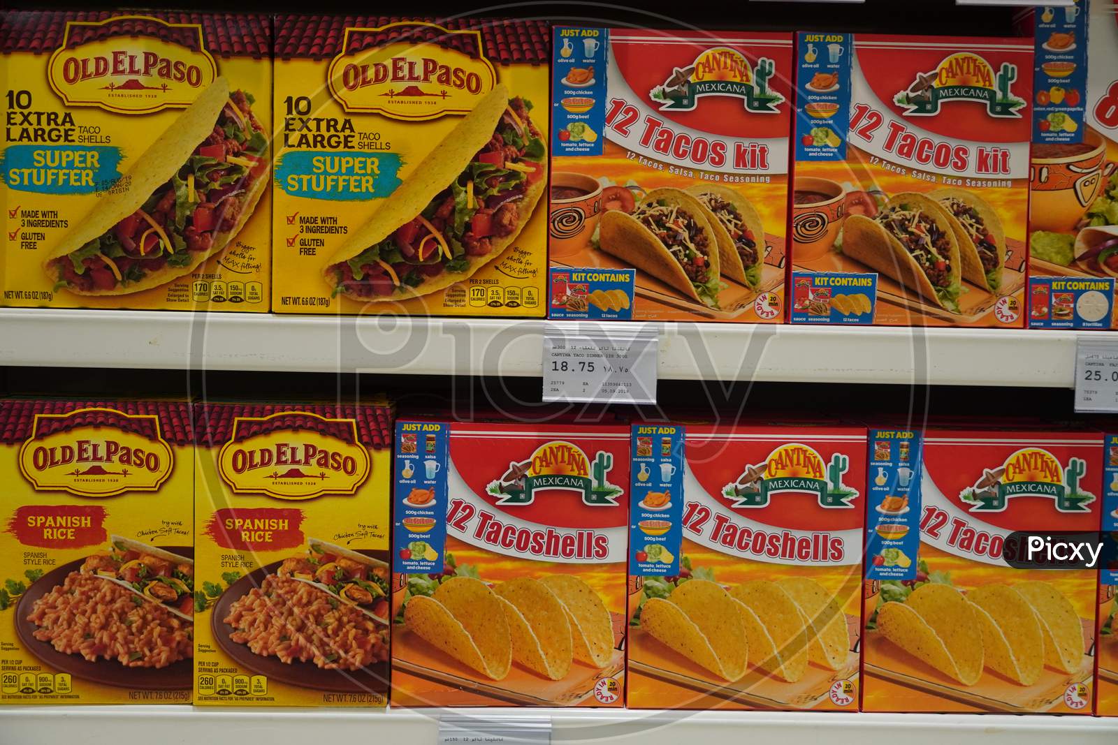 Assorted A Packed Of Taco Shells Display For Sale In The Supermarket Shelves. Also Present Salsa Bottles. Hard Shell Corn Taco Shells Boxes.