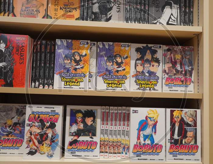 Various Japanese Cartoon Books For Sale In A Bookshop. Anime, Mange. Various Mangas On Display For Sale. Manga Comic Books. Japanese Culture. Japan Comic Magazines.