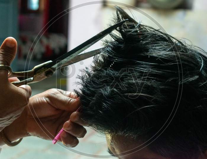 People take haircut at home during the lockdowm imposed due to coronavirus or covid 19 spread